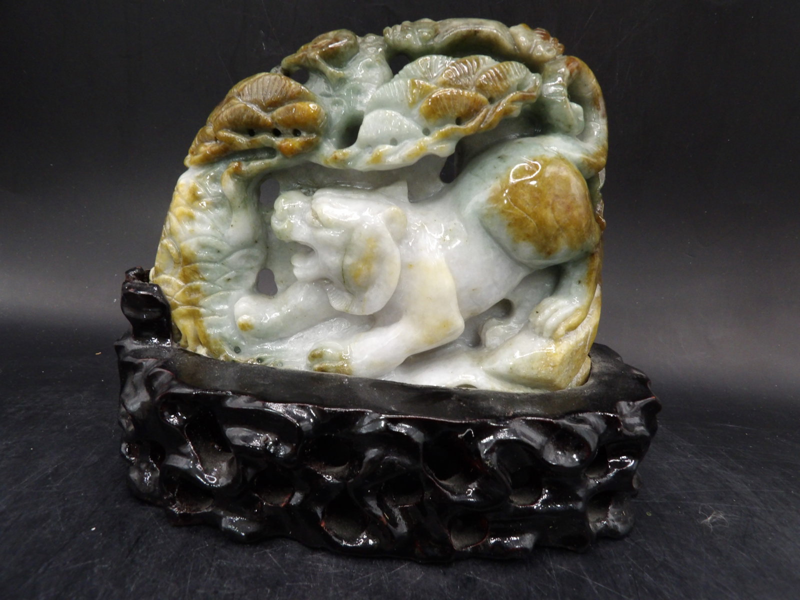 Chinese carved jadeite jade mythical creature adhered to wooden base: 5 inches carving on 6 inches length custom wood base.