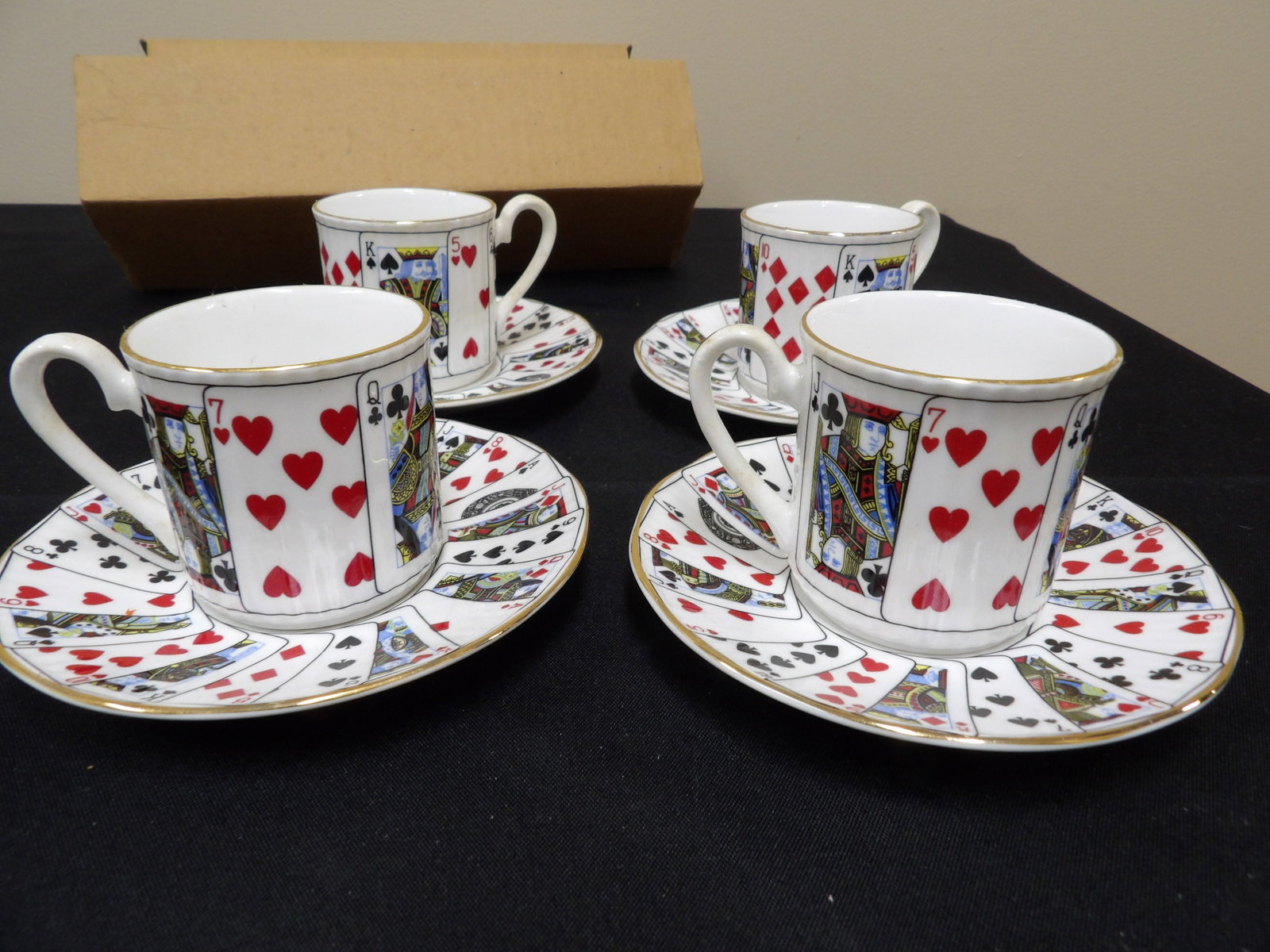 lot of 8 Staffordshire bone China Elizabethan demitasse cups and saucers with playing card motif: Saucer is approx 5.5 inches diameter.