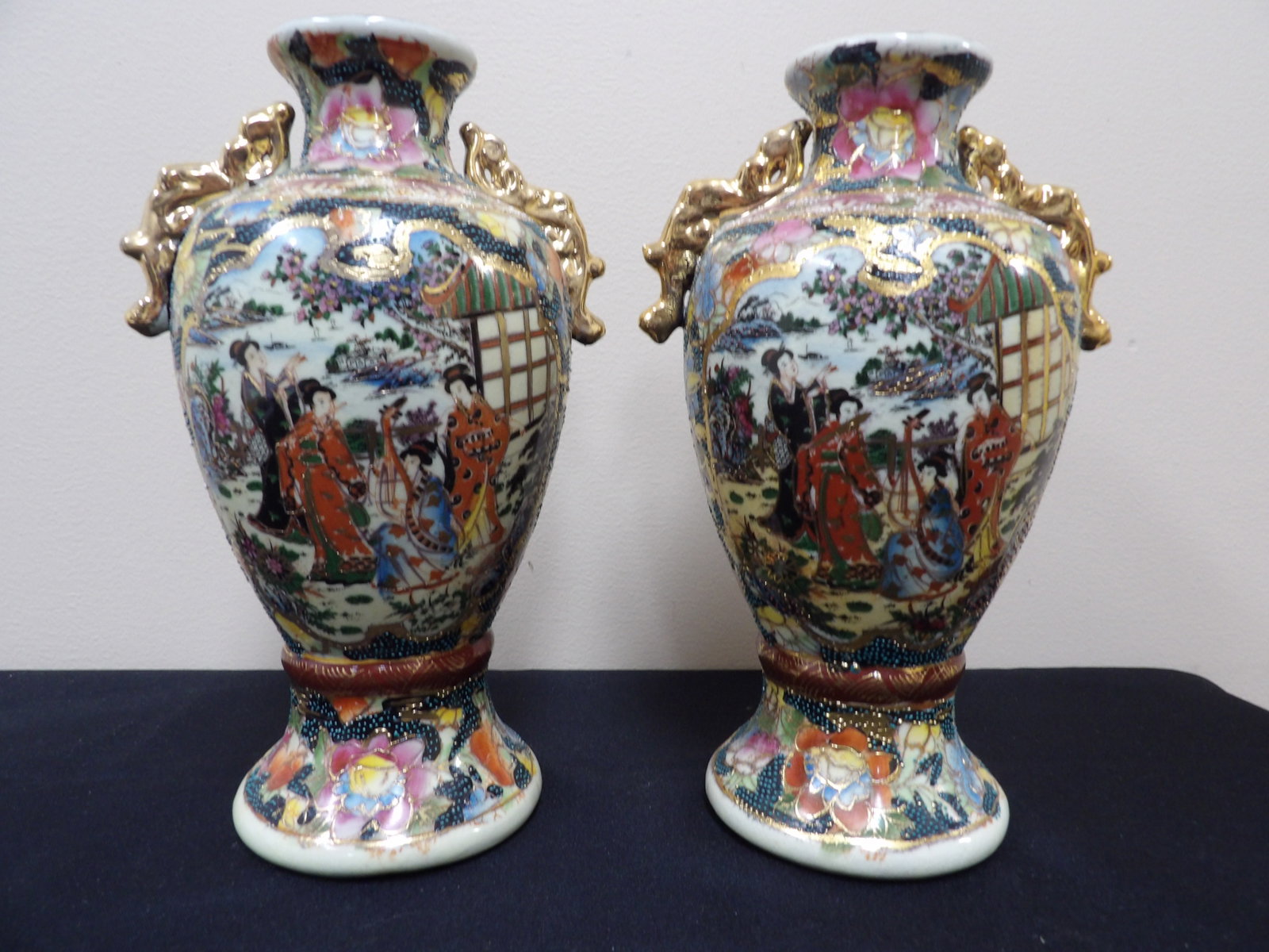 pair of Chinese export porcelain Japanese Satsuma style porcelain vases with gold gilded ears: Approx 10 inches height.