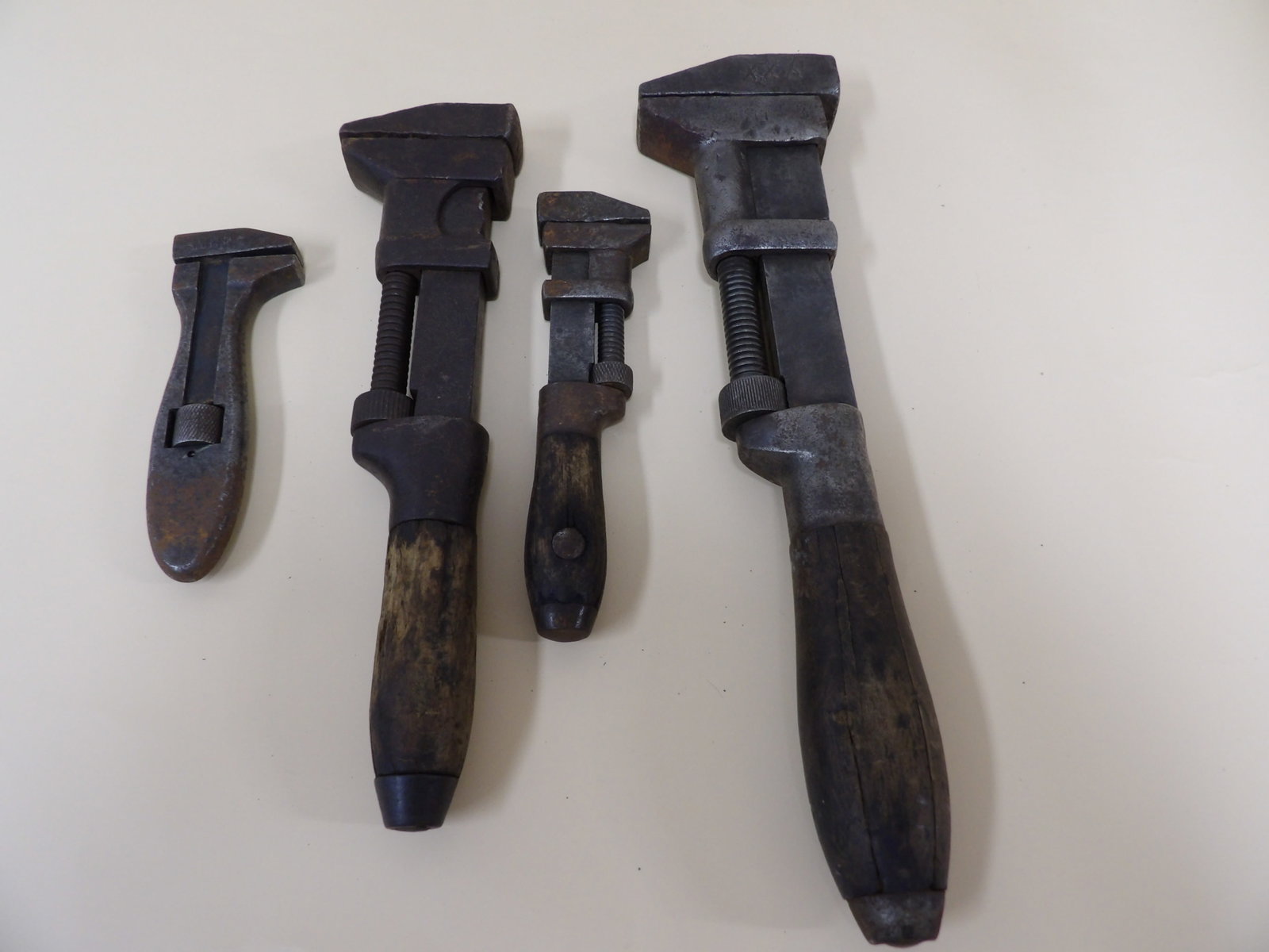 lot of 4 antique wrenches: The longest one is 12 inches. We will inhouse ship items to you very affordable and efficient. Select self-arrange shipping.