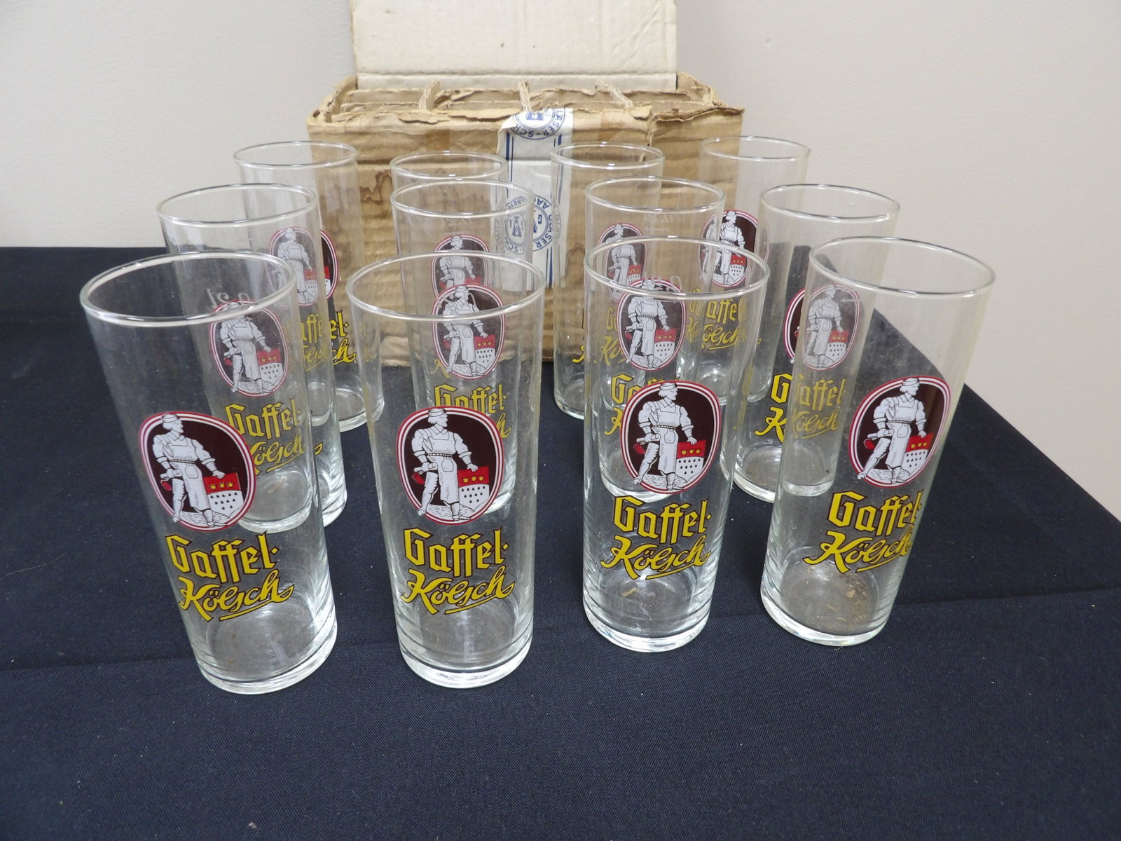 lot of 12 Gaffel Kolsch beer glasses with original cardboard box: 5.3 inches height beer glass. We will inhouse ship items to you very affordable and efficient. Select self-arrange shipping.
