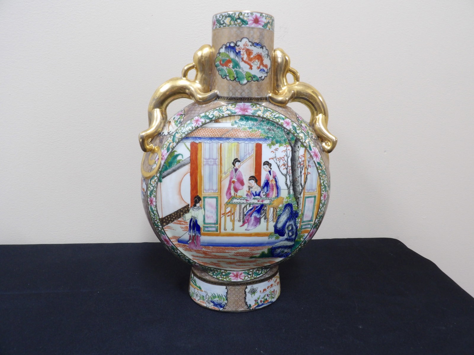 ornate Chinese famille rose style porcelain moon vase with dragon handles: 14 inches height.