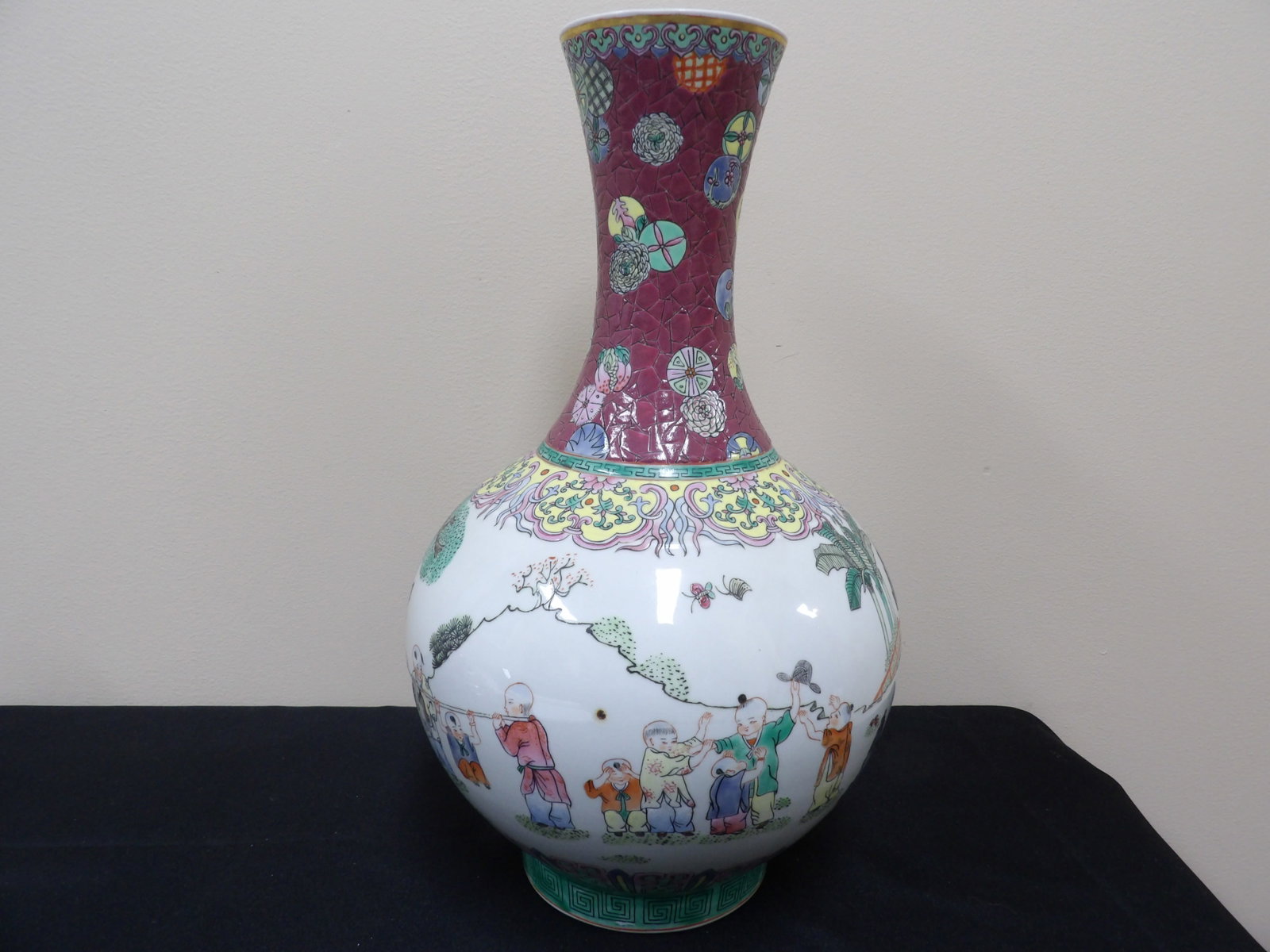 Chinese porcelain famille rose vase depicting children at play: 15.3 inches height. Unmarked.