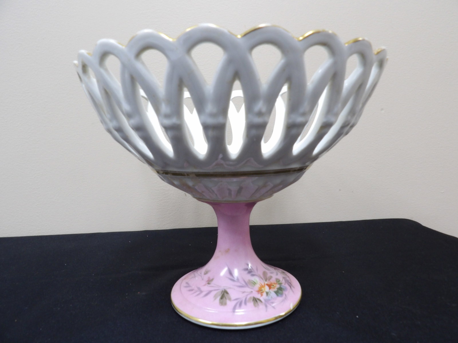 antique reticulated compote dish with hand painted flowers probably Old Paris with pink gold gilt: 7.6 inches height.