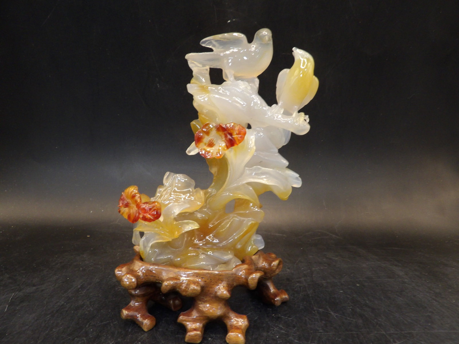 Chinese fine agate carved sculpture of birds and flowers adhered on custom wood base: 5.7 inches height including wood base.