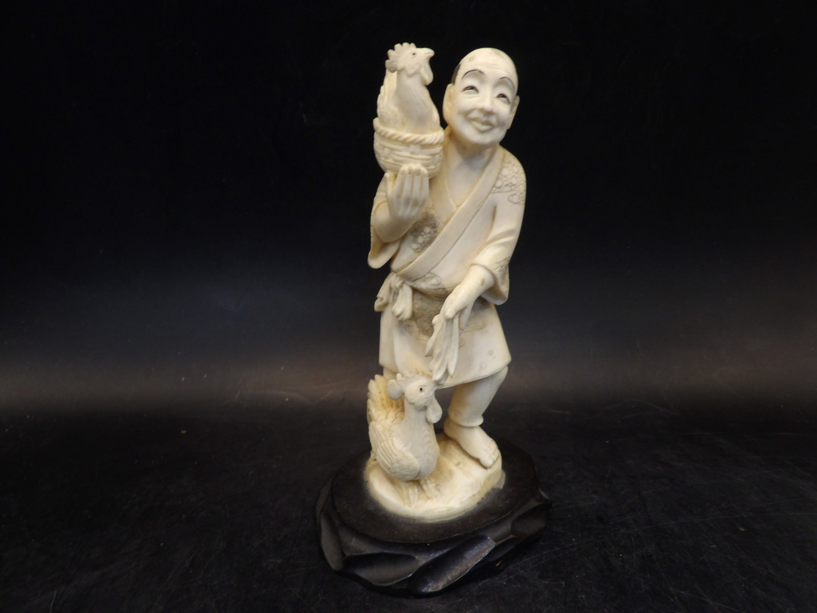 antique Japanese Okimono of a smiling man with a rooster and chicken adhered to wooden base: 5.6 inches height including base. Fine carving. No international shipping.