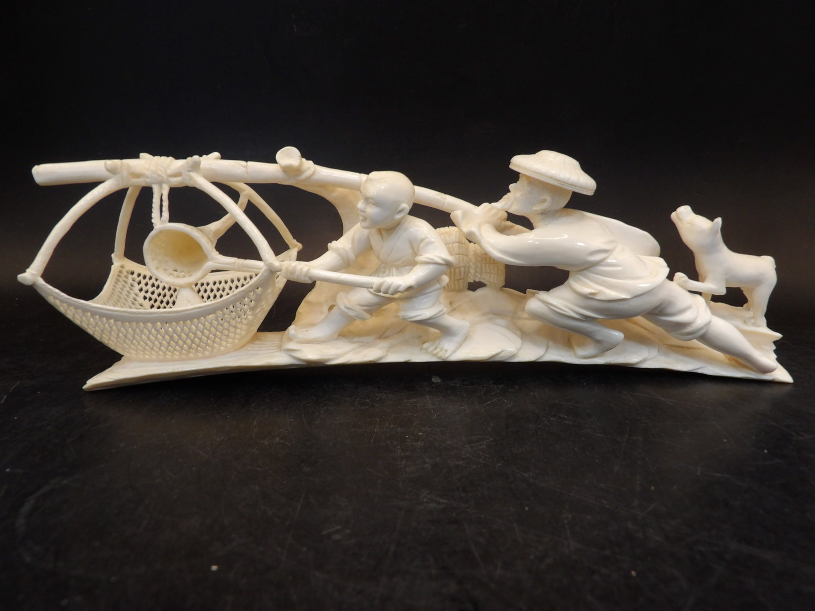 Exceptional Japanese carved okimono depicting fishing scene with a net probably Meiji period: 8 inches length. No international shipping.