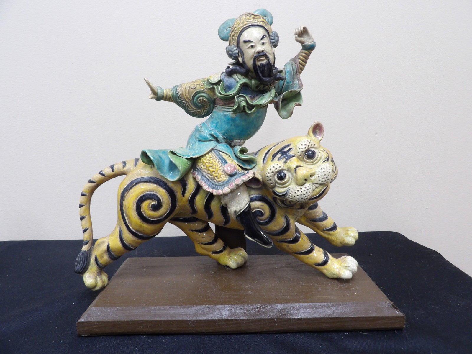 fine Chinese polychrome glazed ceramic roof tile depicting a warrior riding tiger: 12 inches length.
