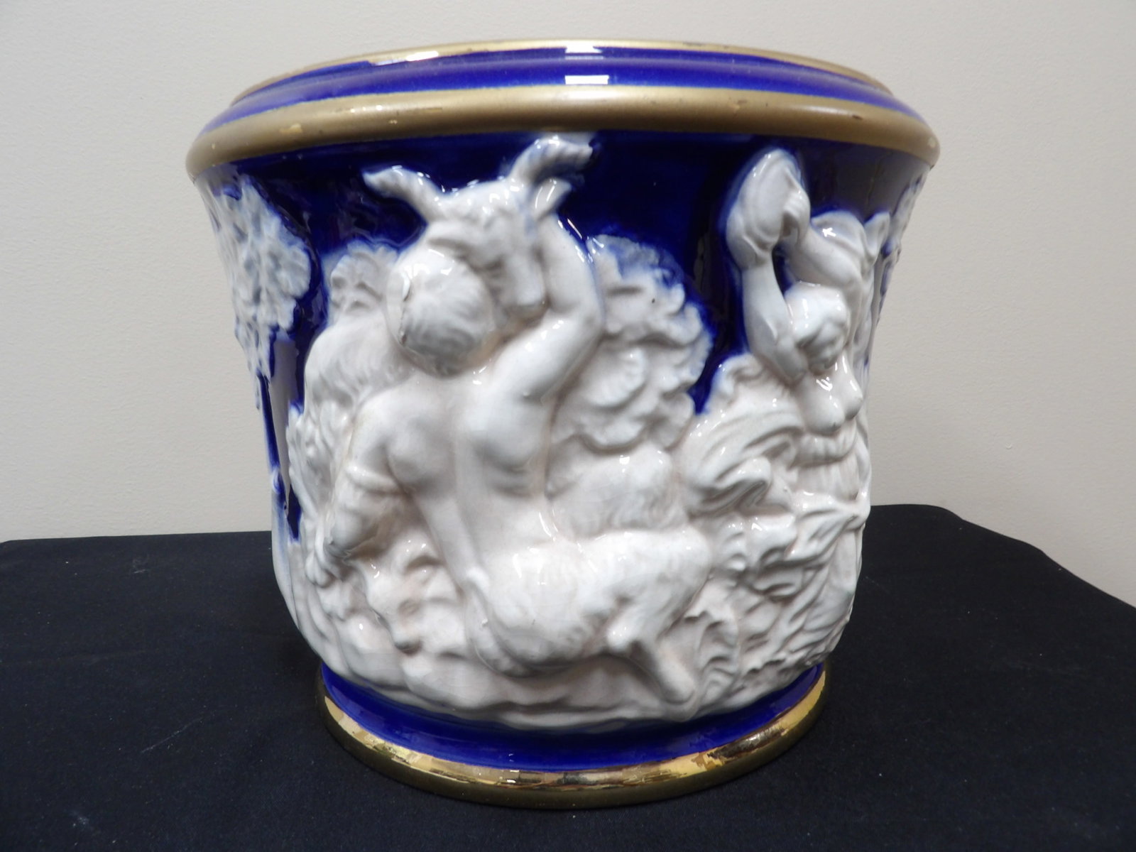 early 20th century Italian ceramic jardiniere featuring mythological relief figures: Approx size is 11 x 11 x 9 inches.