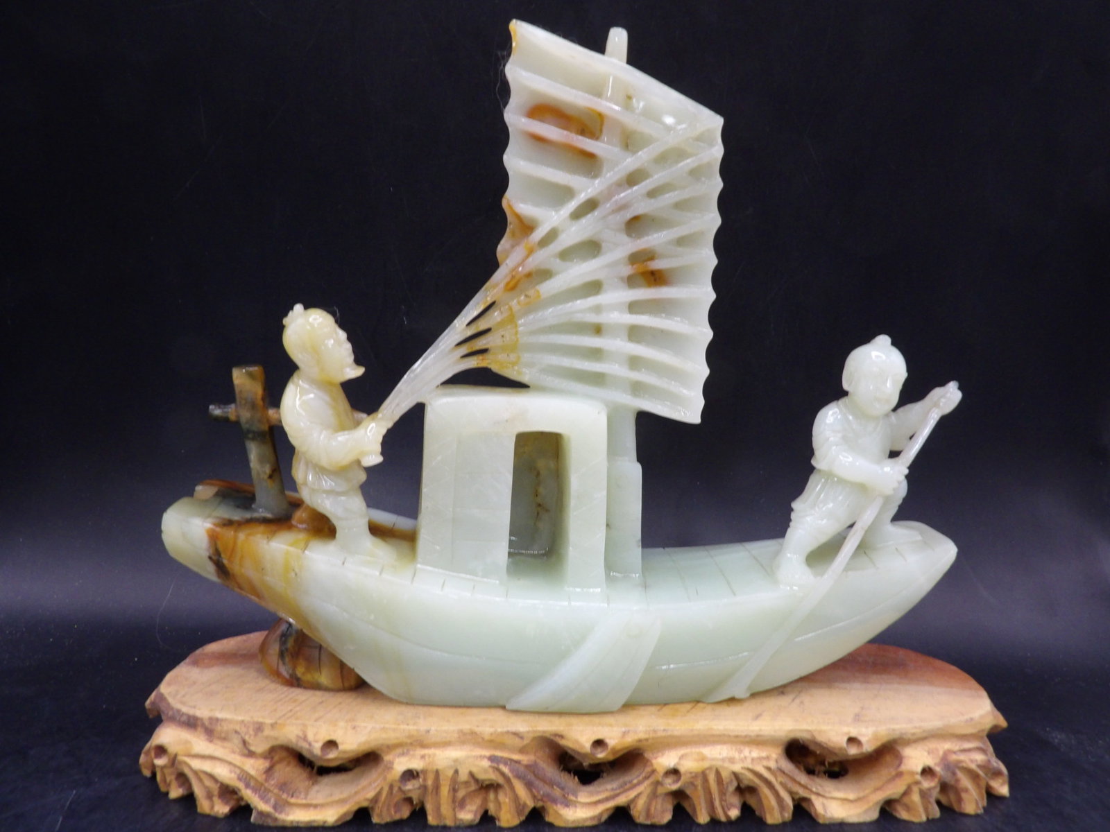 Chinese jade carved sampan boat and fishermen sculpture: 8.2 inches length. 890 grams.