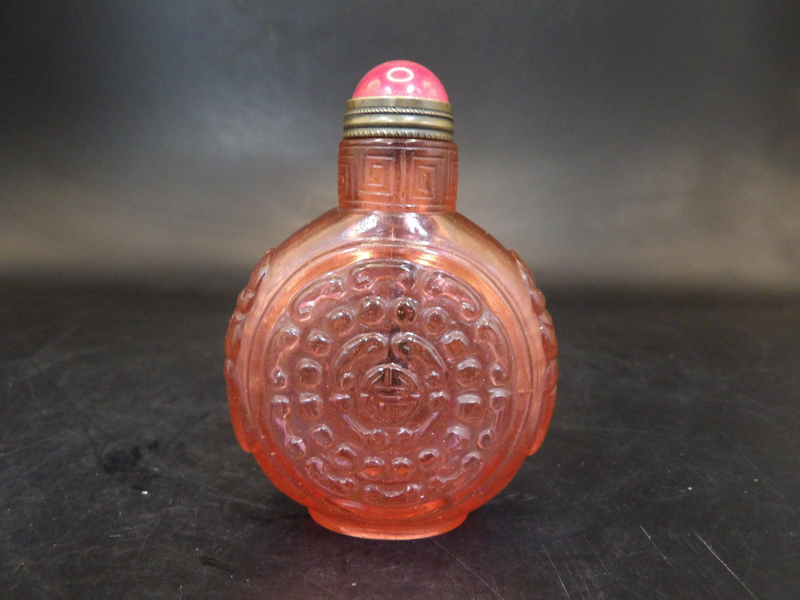 Chinese Qing dynasty pink glass snuff bottle with mask handles: 2.4 inches height.
