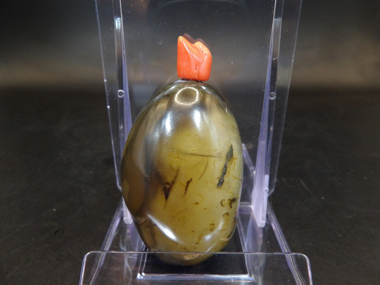 Chinese pebble agate carved snuff bottle with coral stopper: 2.6 inches height.