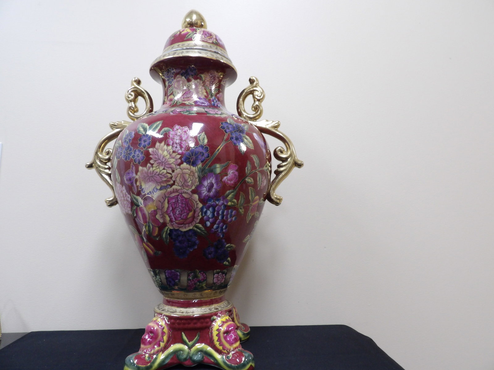 very large burgundy ground floral pattern lidded ceramic vase by Oriental Accents: Over 25 inches height.