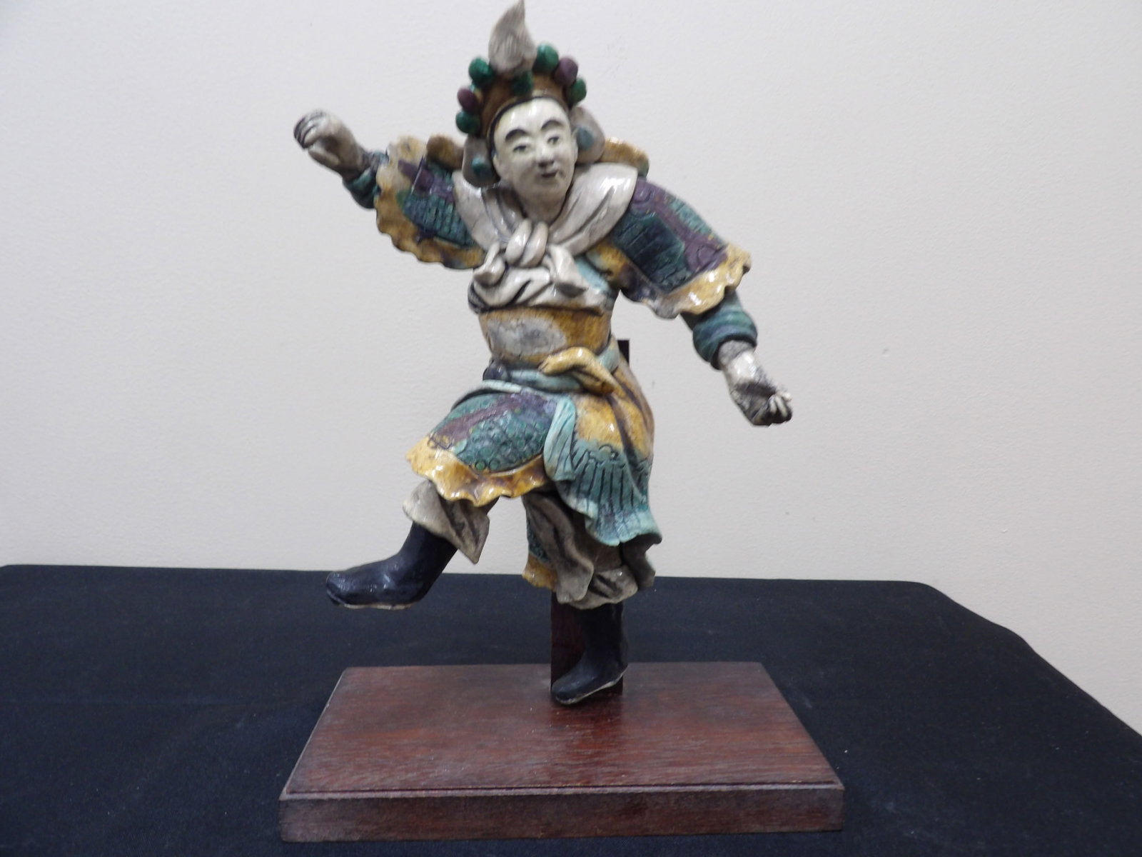 Qing dynasty Chinese roof tile depicting a warrior with one leg up on wood base (1 of 7)