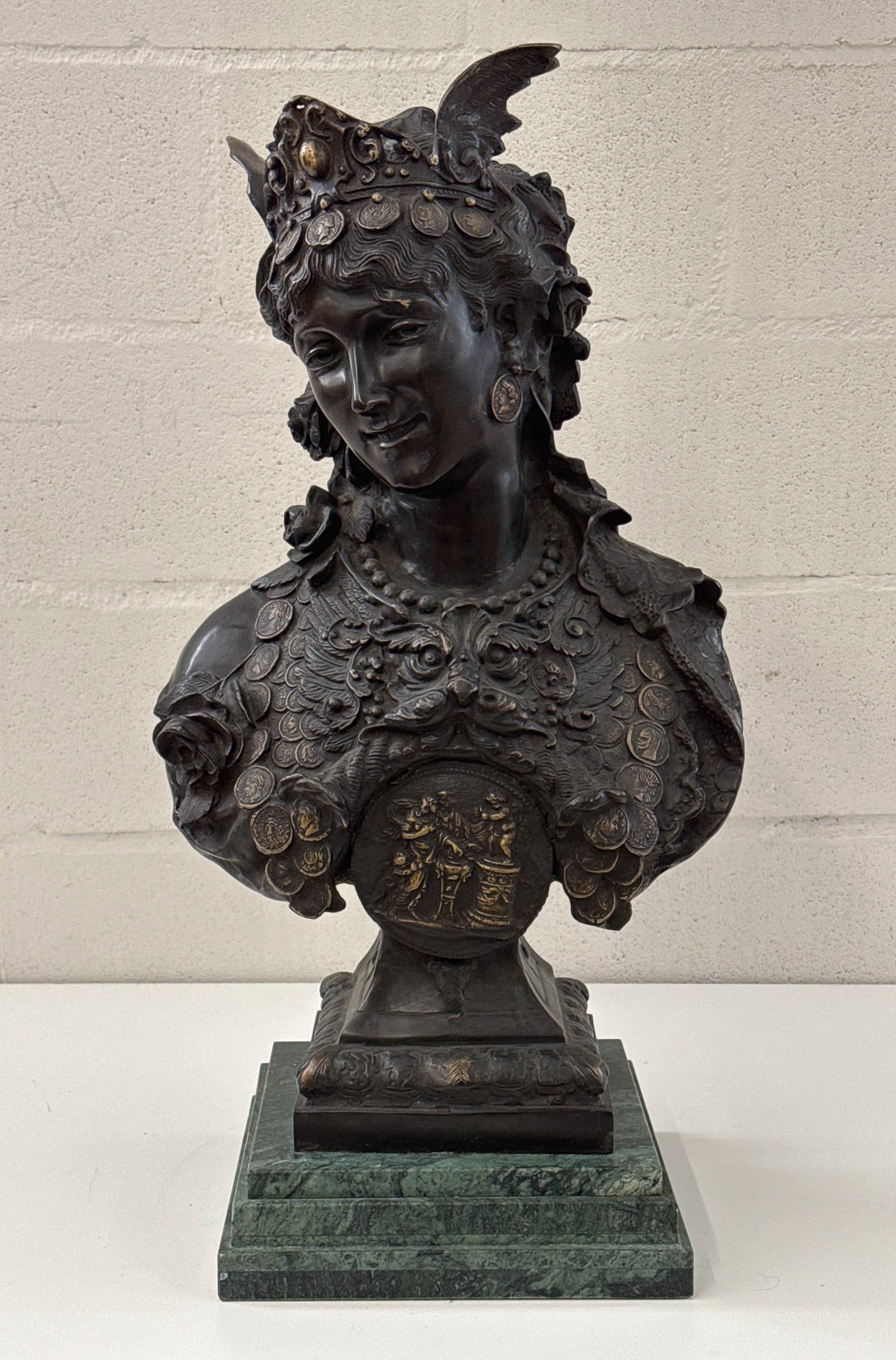 Time Is Money Allegory Bronze Bust: Time Is Money Allegory Bronze Bust, 20th Century, Young Woman With Winged Headdress And Coin Breastplate After The Original By Arthur Waagen, 1833-1898, On A Green Marble Plinth, 27 X 15 X 11 Inches.
