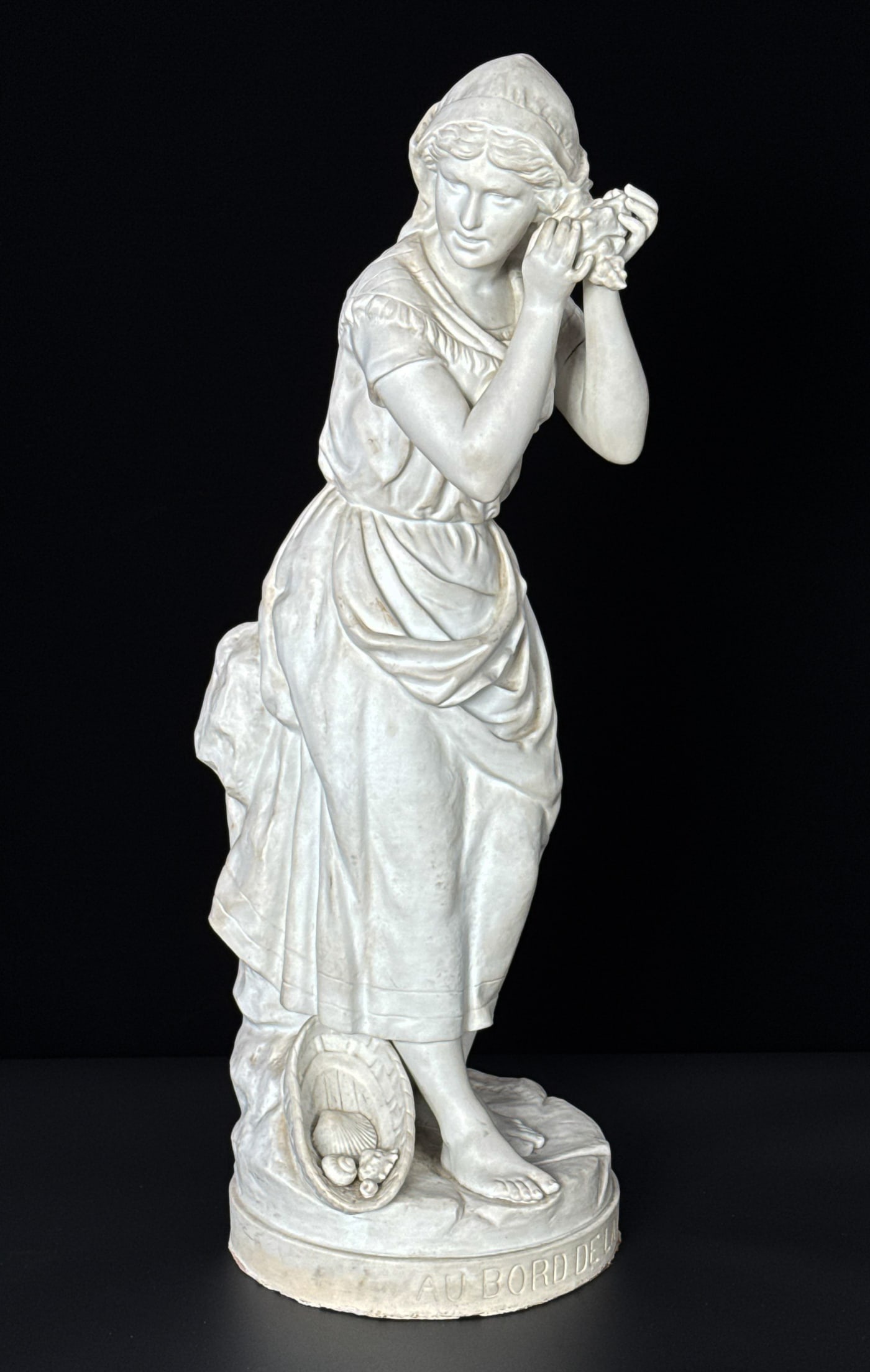 Nicolas Lecornet, French, Active 1880-1884: Nicolas Lecornet, French, Active 1880-1884, A Bord De La Mer, Breton Girl With Sea Shells, Bisque Porcelain, Signed Lecornet Bb Paris On Base, Height 28, Diameter 10 Inches, Surface Dirt And Accretion