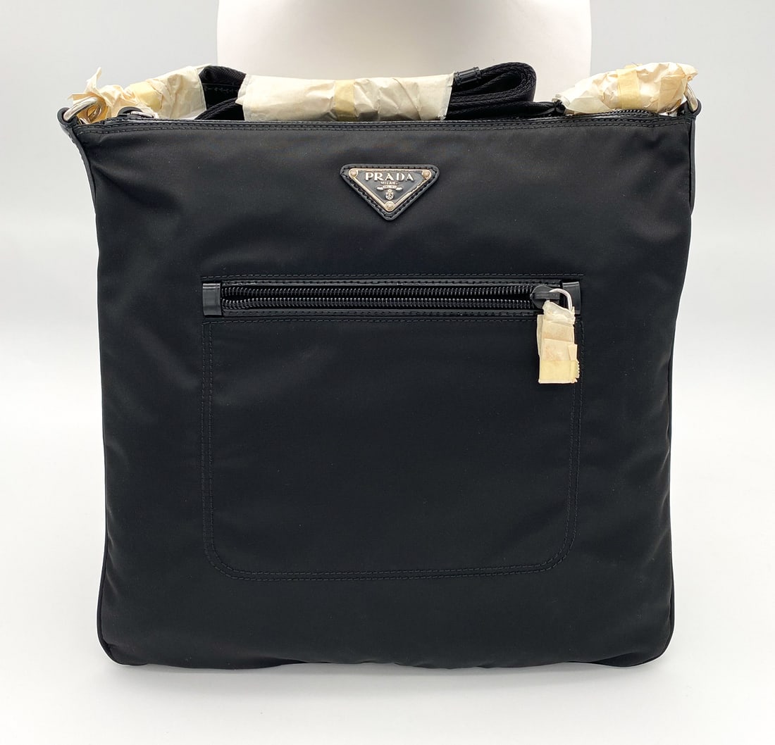 Prada Tessuto Nylon Crossbody Bag: Prada Tessuto Bandoliera Nylon Crossbody Bag, Black, Retains Protective Paper At Fobs And Strap. Appears Never Carried. Logo Plaque Shows Oxidation. Base 6.75 X 7.75 X .25 Inches, Strap Drop Adjustabl