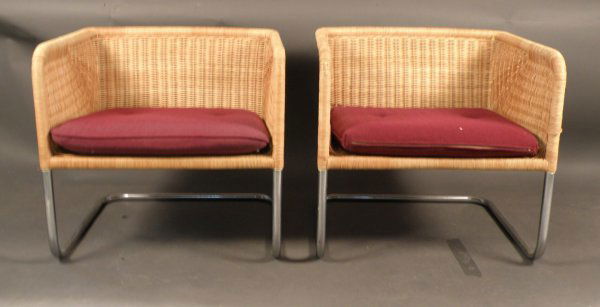 Harvey Probber pair of tub Chairs: Hand wrapped cane on a chrome tubular frame, unmarked….manufactered by Belicki Loose cranberry color cushions 24" h x 25.5" x 23" Overall condition is very good….very minor