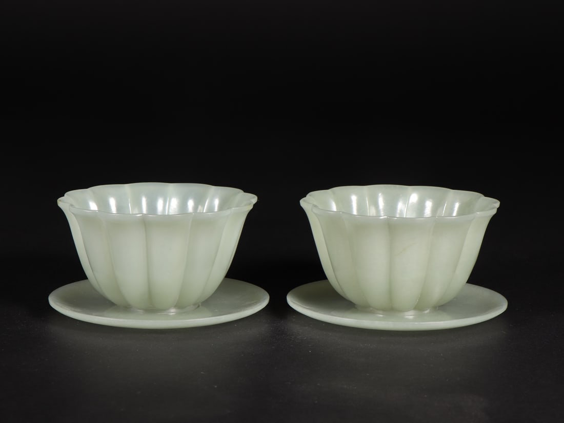 A pair of Qing Dynasty Hetian jade melon ling cups with saucers (1 of 9)