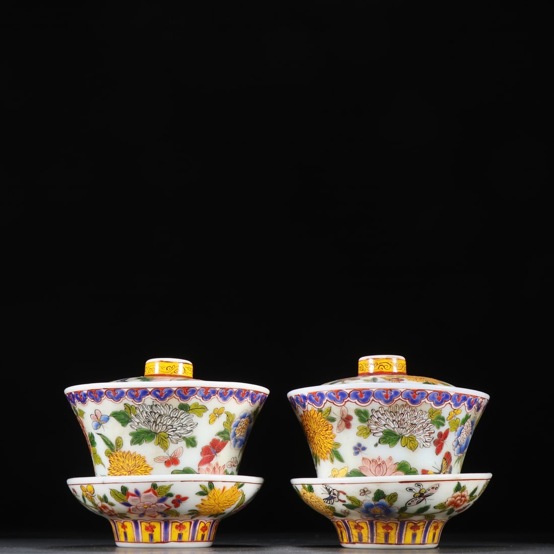 A pair of Qing Dynasty material vessels painted enamel flower butterfly pattern tea cups: A pair of tea cups painted with enamel flowers and butterfly patterns in the Qing Dynasty SIZE: H:10cm W:11.2cm W:367.8g (The Dimensions Of All Batches Are Manually Measured.If You Need More Detailed