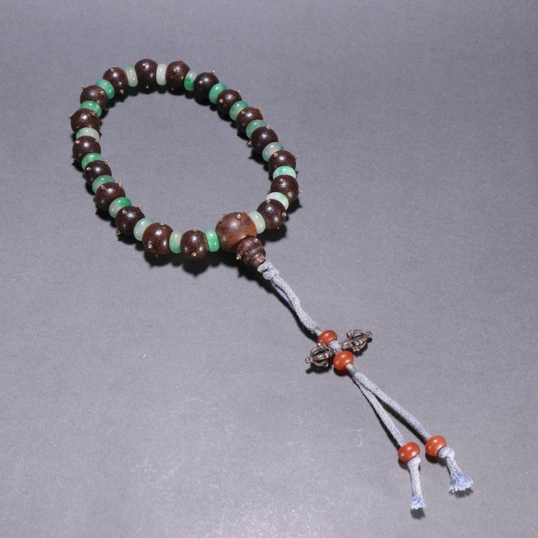 A piece of agarwood from the Qing Dynasty with jadeite beads held by eighteen sons (1 of 9)