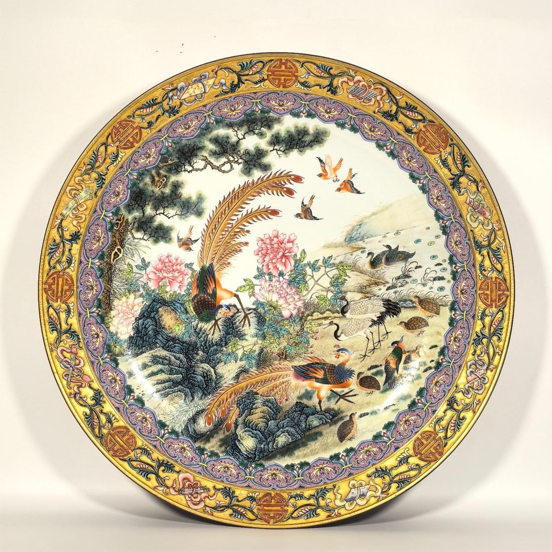 A Qing Dynasty Qianlong era enamel color hundred birds to the phoenix plate (1 of 9)