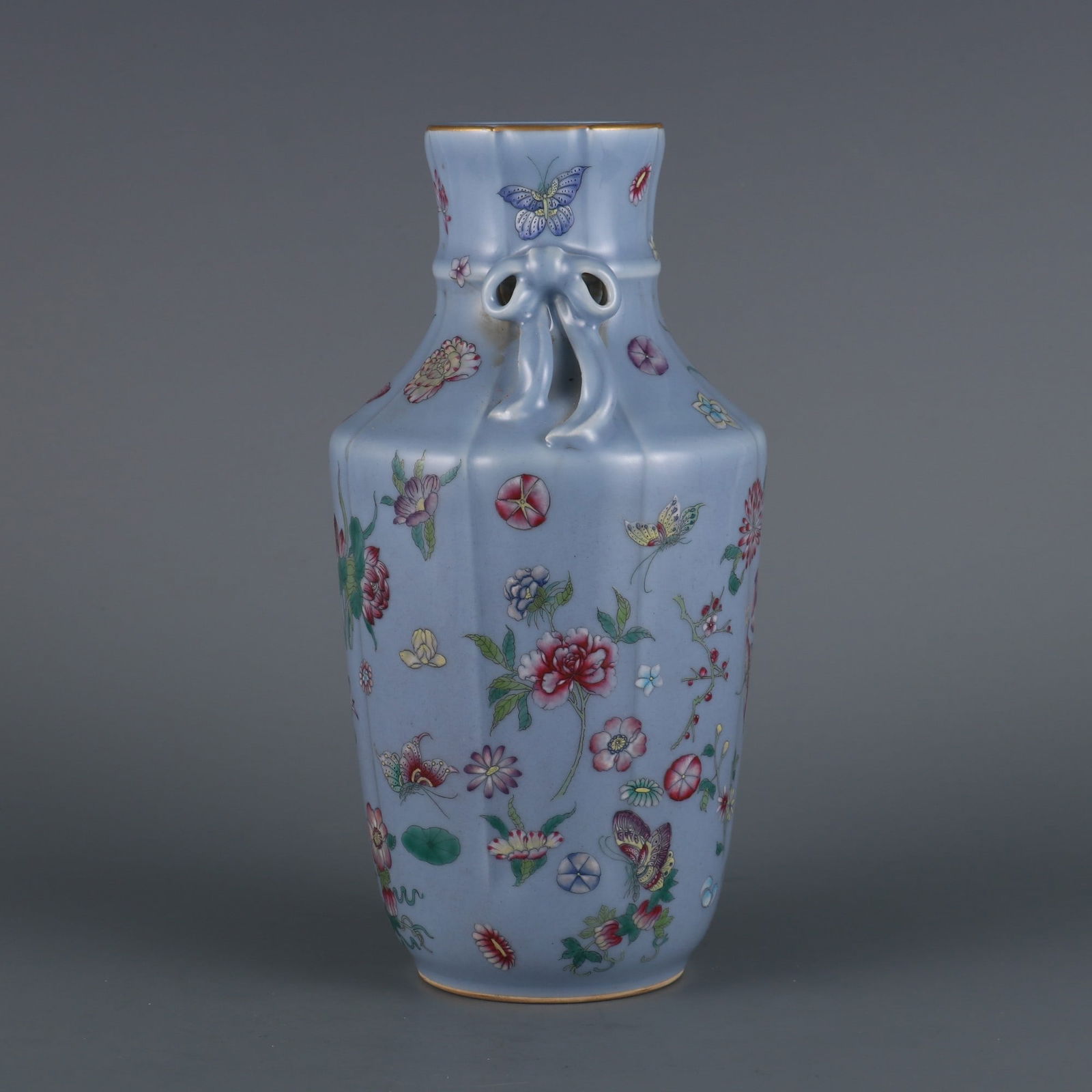 A piece of sky blue glaze made in the Qianlong period of the Qing Dynasty with pastel butterfly love: The sky blue glaze made in the Qianlong period of the Qing Dynasty with pastel butterfly love flower streamers and melon lingzuns Size: H:23.3cm Mouth D:6.5cm (The Dimensions Of All Batches Are Manual
