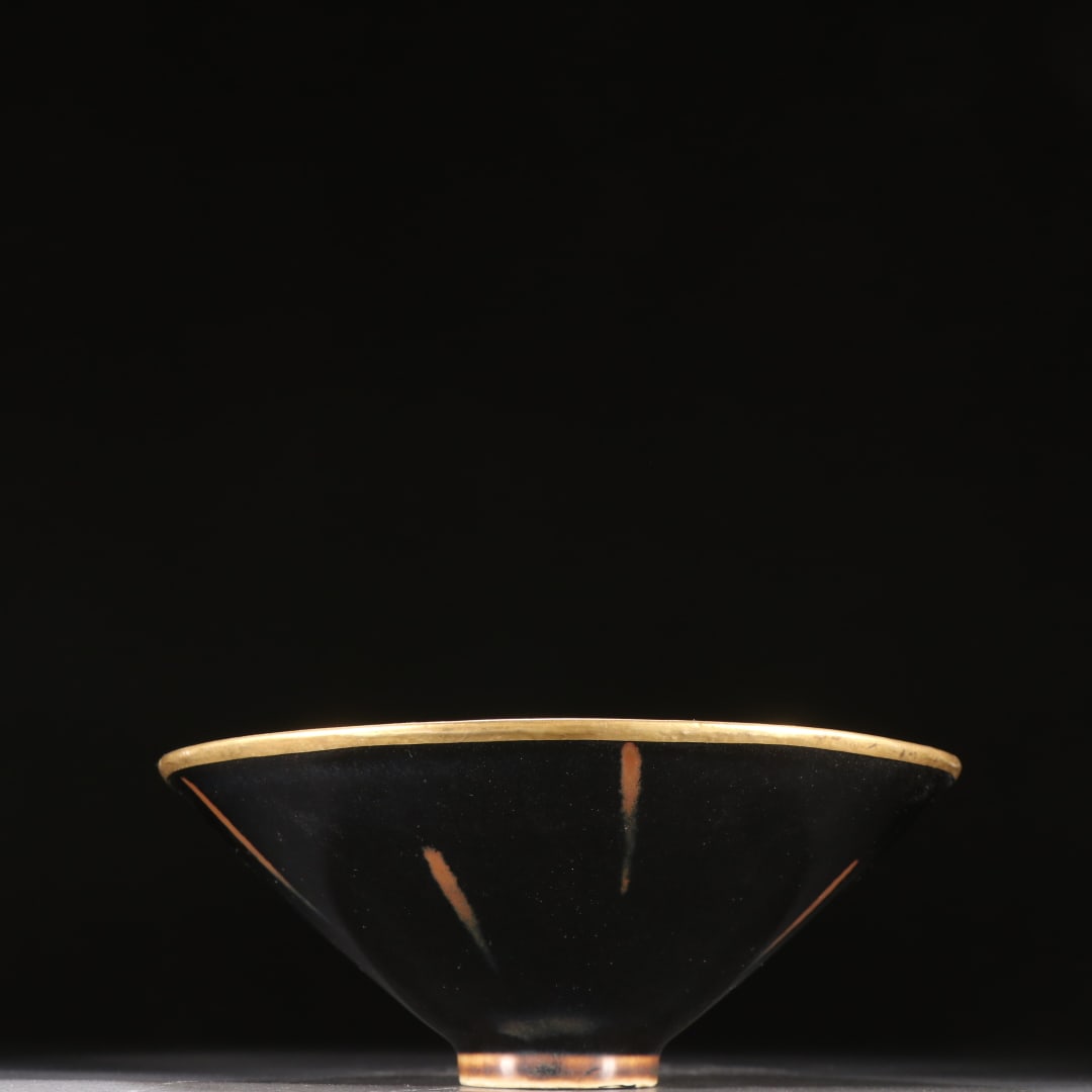 A black-glazed gold-coated tea cup from the Song Dynasty: Song Dynasty black-glazed gold-covered tea cup SIZE: H:7cm W:12.6cm (The Dimensions Of All Batches Are Manually Measured.If You Need More Detailed Information, Please Contact Our Customer Service Befo