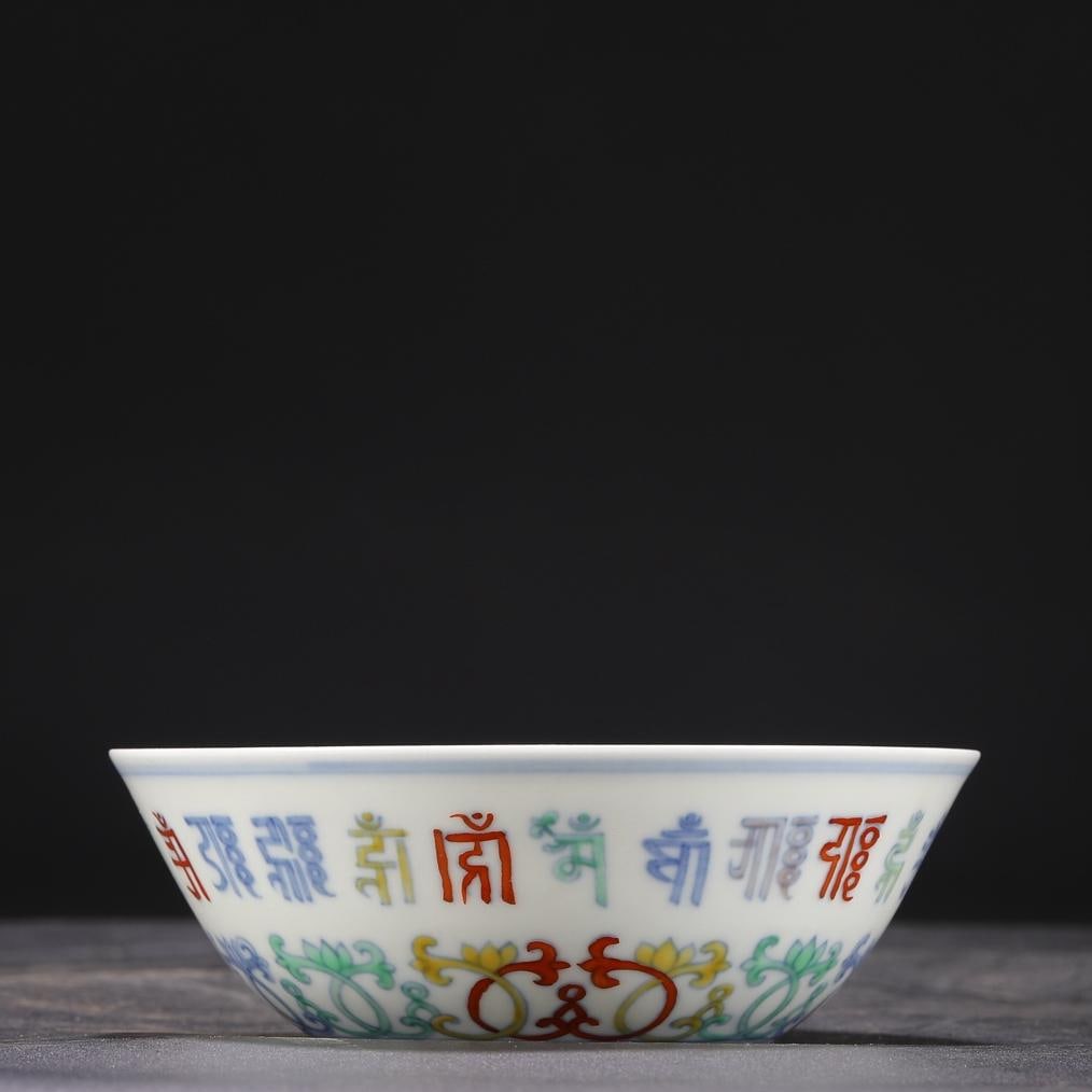 A Doucai Sanskrit palace bowl made in the Chenghua year of the Ming Dynasty: The Doucai Sanskrit palace bowl of the Ming Dynasty Chenghua year Size:H:5cm Calibre:14cm (The Dimensions Of All Batches Are Manually Measured.If You Need More Detailed Information, Please Contact Our