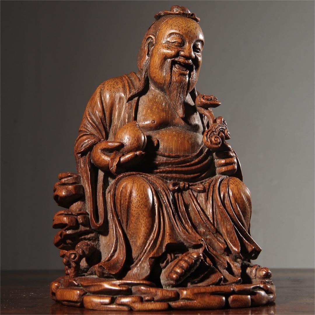 A bamboo root carving of the Qing Dynasty Fu Lu Shou Immortal He Shou Seated Statue Ornament (1 of 9)