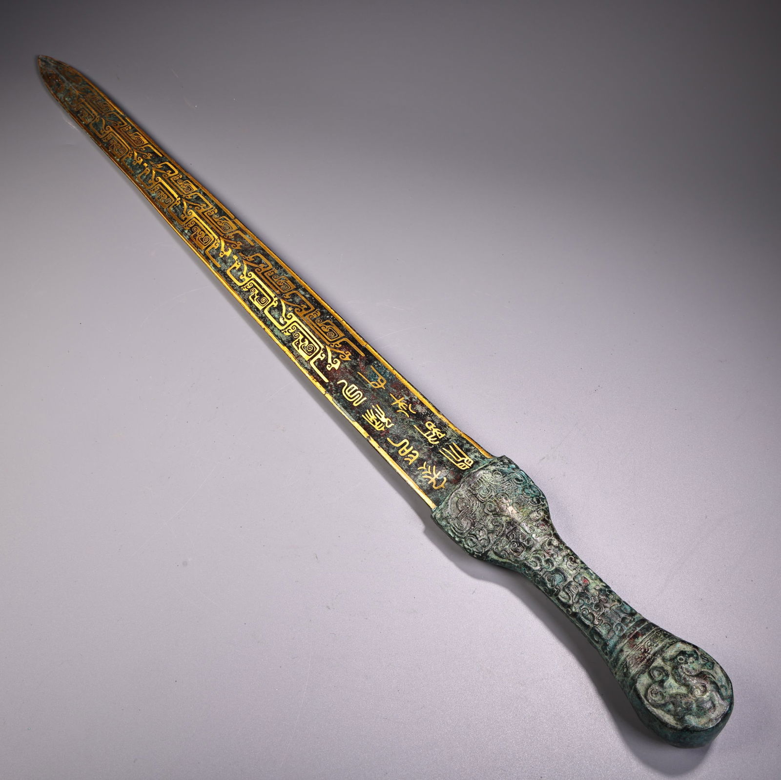 A fine bronze sword with inscription gold belt: Exquisite bronze sword with inscription on gold belt Size:W:830g L:66.5cm W:5cm (The Dimensions Of All Batches Are Manually Measured.If You Need More Detailed Information, Please Contact Our Customer