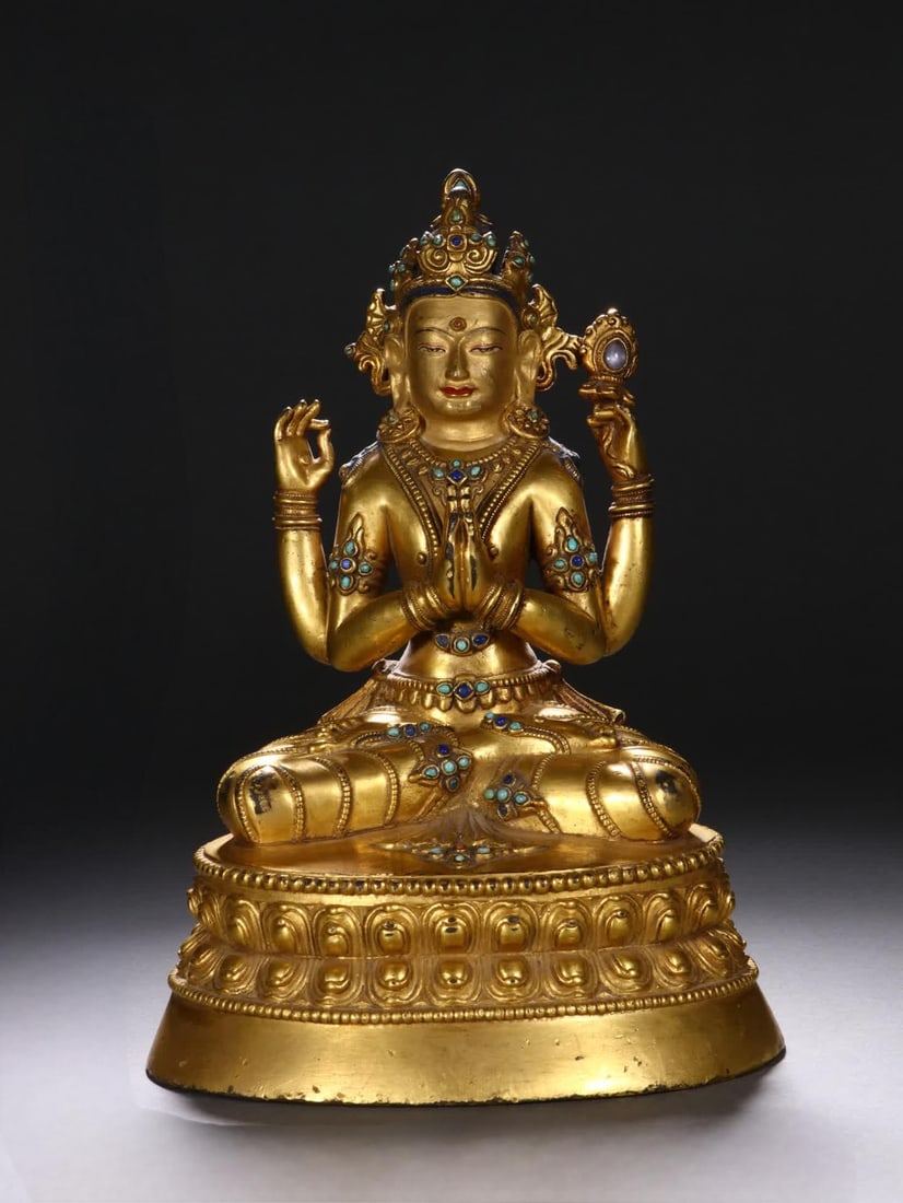 A Qing Dynasty bronze gilt four-armed Guanyin statue (1 of 11)