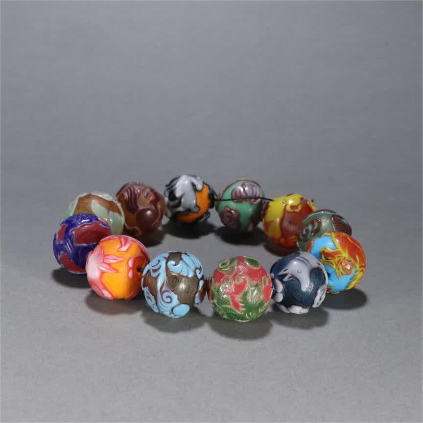 A glazed relief zodiac bracelet: Glass relief zodiac bracelet SIZE: Bead diameter 2.6cm W: 139.4g (The Dimensions Of All Batches Are Manually Measured.If You Need More Detailed Information, Please Contact Our Customer Service Before