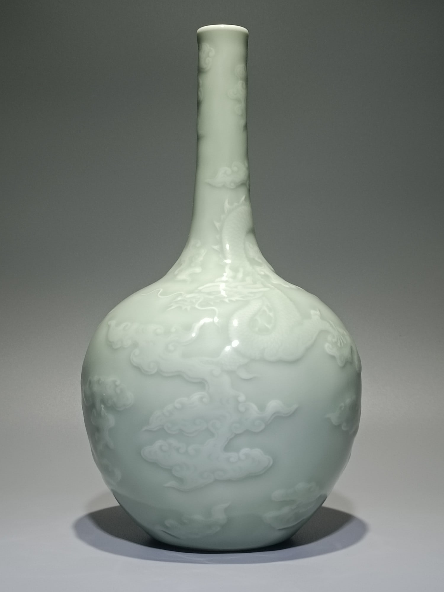 A Qing Dynasty Qianlong bean celadon carved Canglong godson long courage bottle: Qing Dynasty Qianlong bean blue glaze carved Canglong godson long courage bottle SIZE: H:28cm W:15.5cm (The Dimensions Of All Batches Are Manually Measured.If You Need More Detailed Information, Pleas