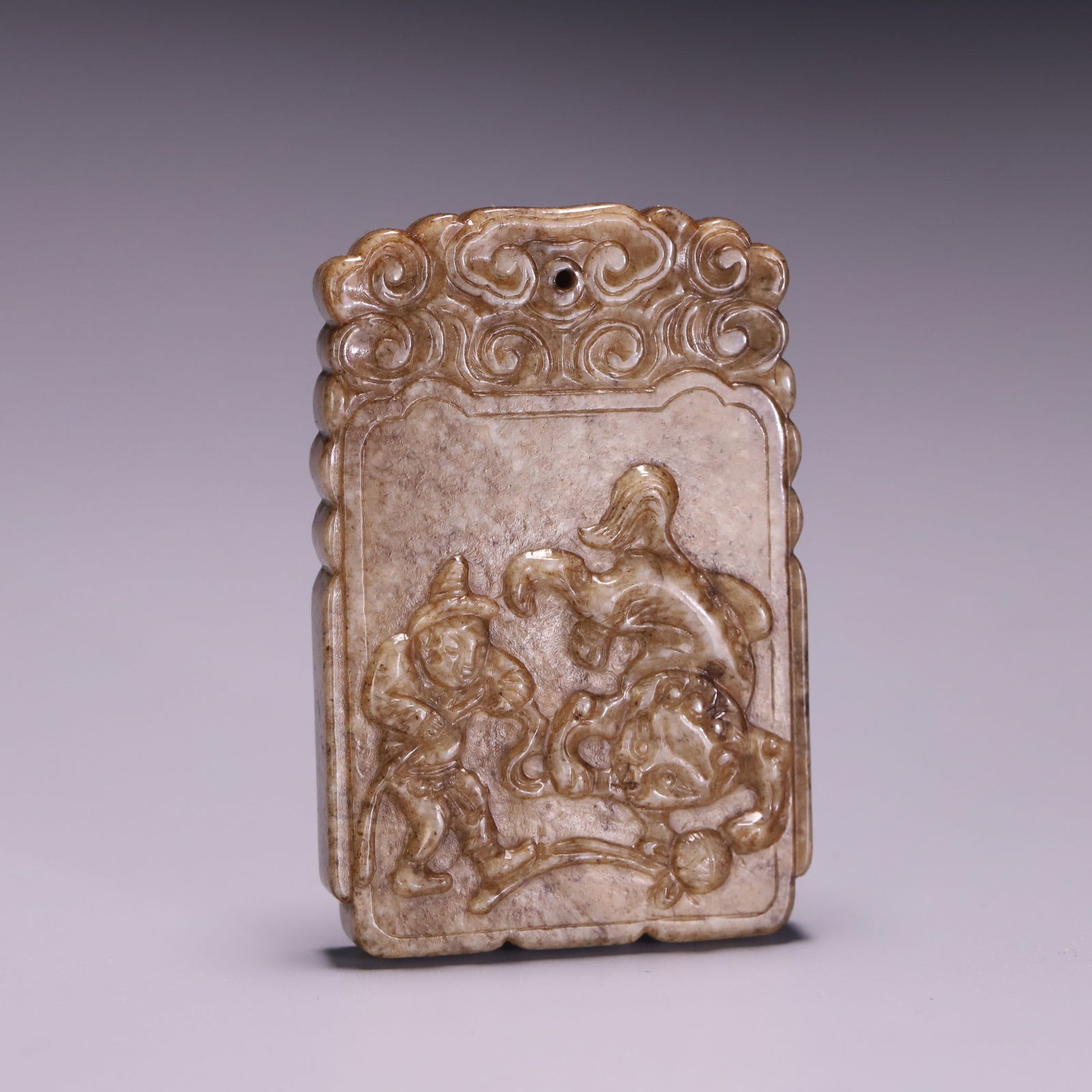 A Hetian jade lion playing card (1 of 9)