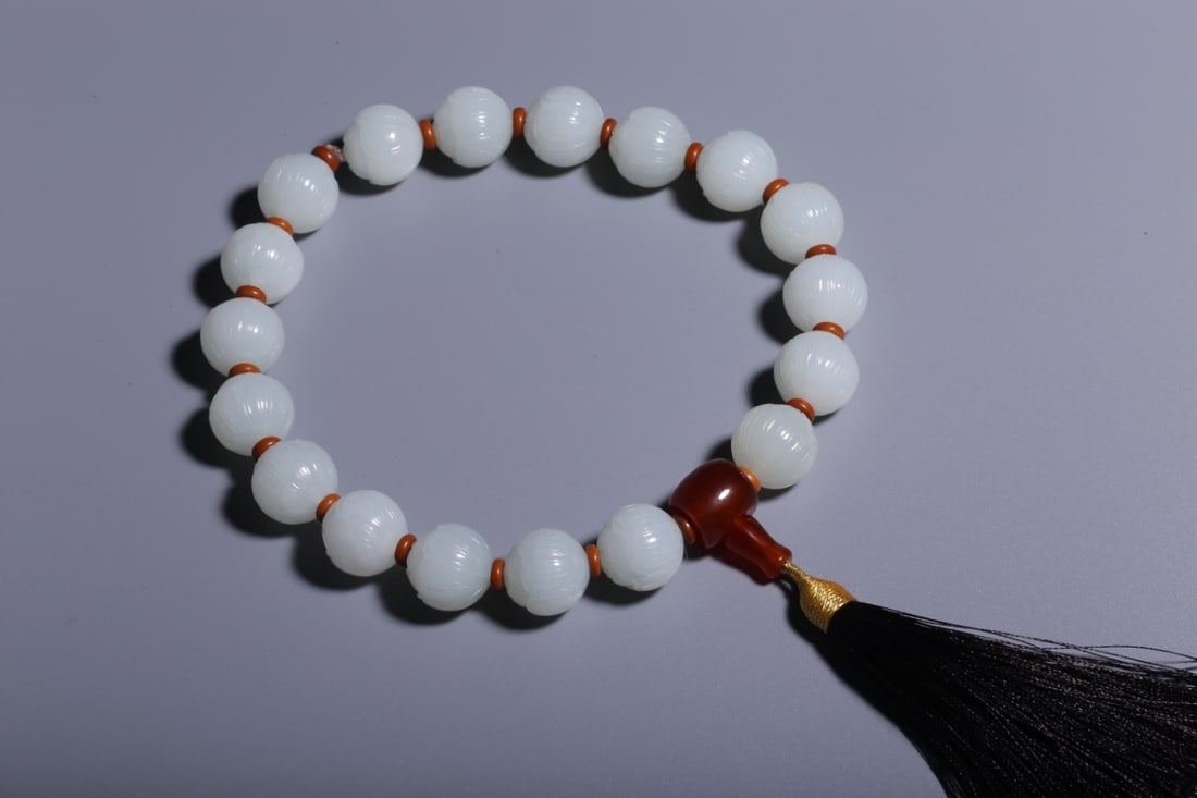 A Qing Dynasty Hetian white jade lotus pattern handheld (1 of 7)