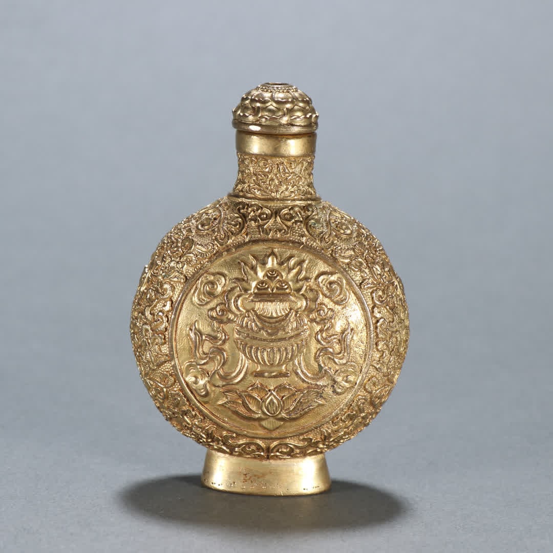 A Qing Dynasty copper gilt eight-treasure pattern snuff bottle (1 of 9)