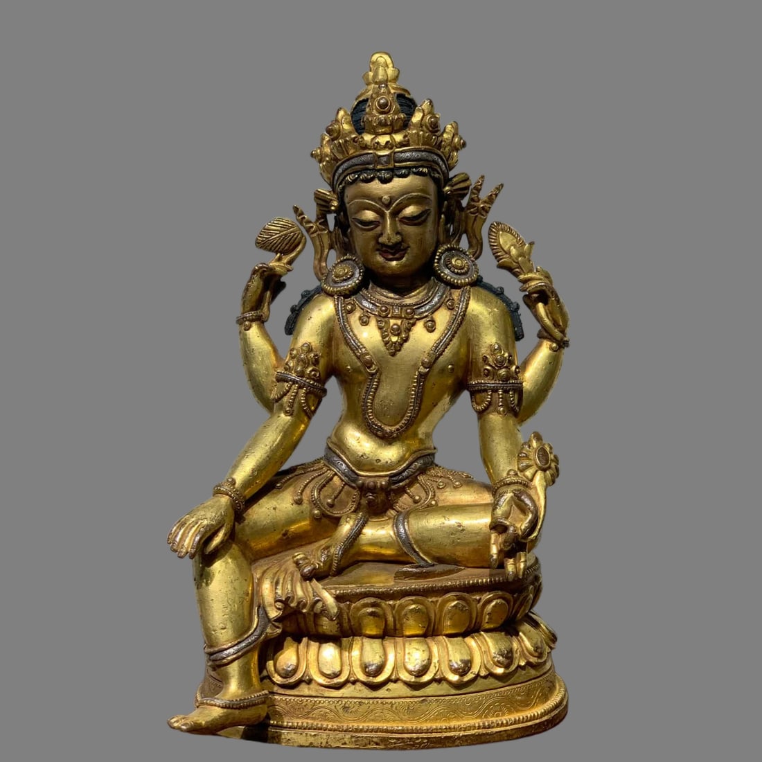 A Ming Dynasty bronze gilt Buddha four-armed Guanyin seated statue (1 of 9)