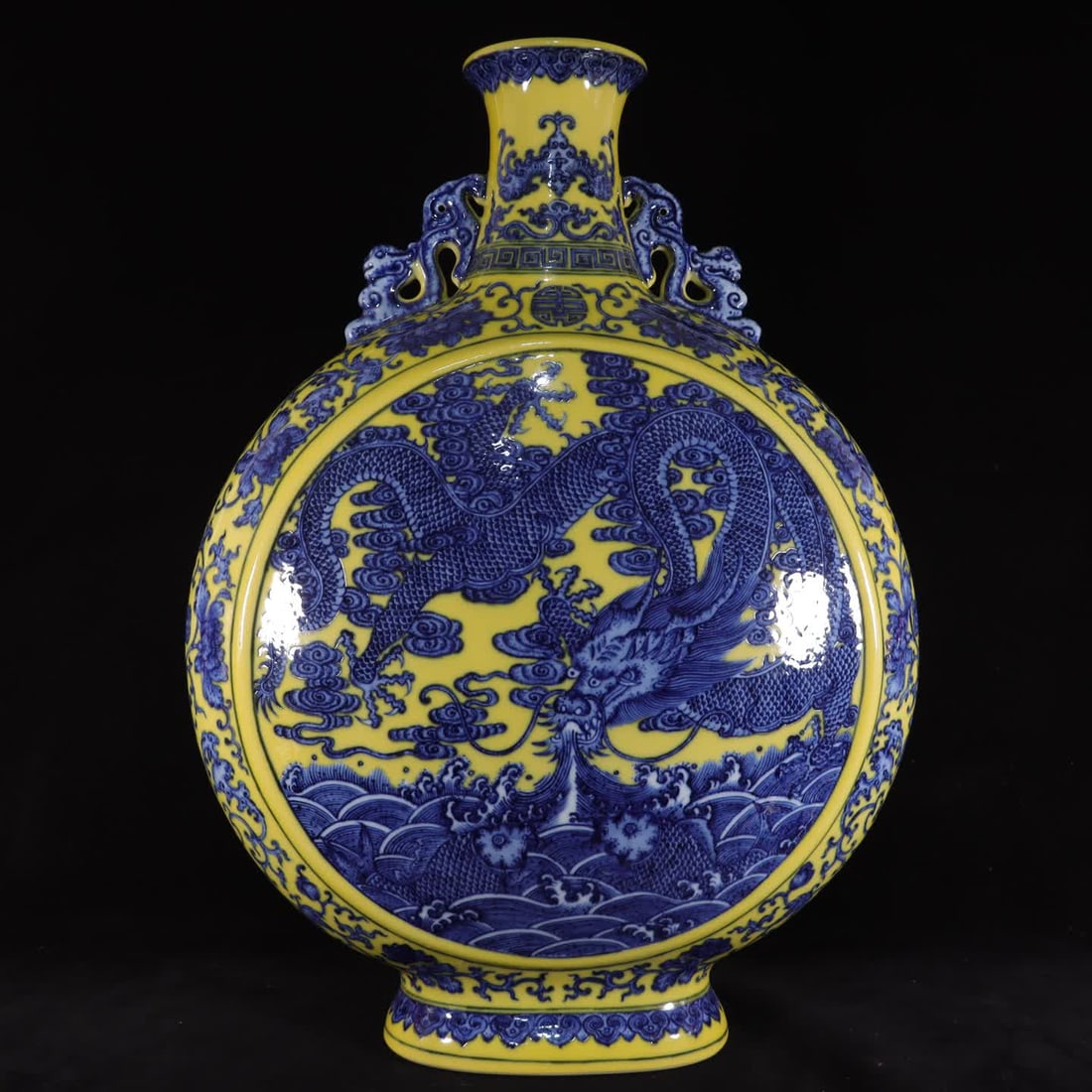 A Qing Dynasty Qianlong model lemon yellow glaze blue and white fish leaping dragon gate moon bottle: Qing Dynasty Qianlong year model lemon yellow glaze mackerel leaping dragon gate moon bottle SIZE: H:58cm W:42cm (The Dimensions Of All Batches Are Manually Measured.If You Need More Detailed