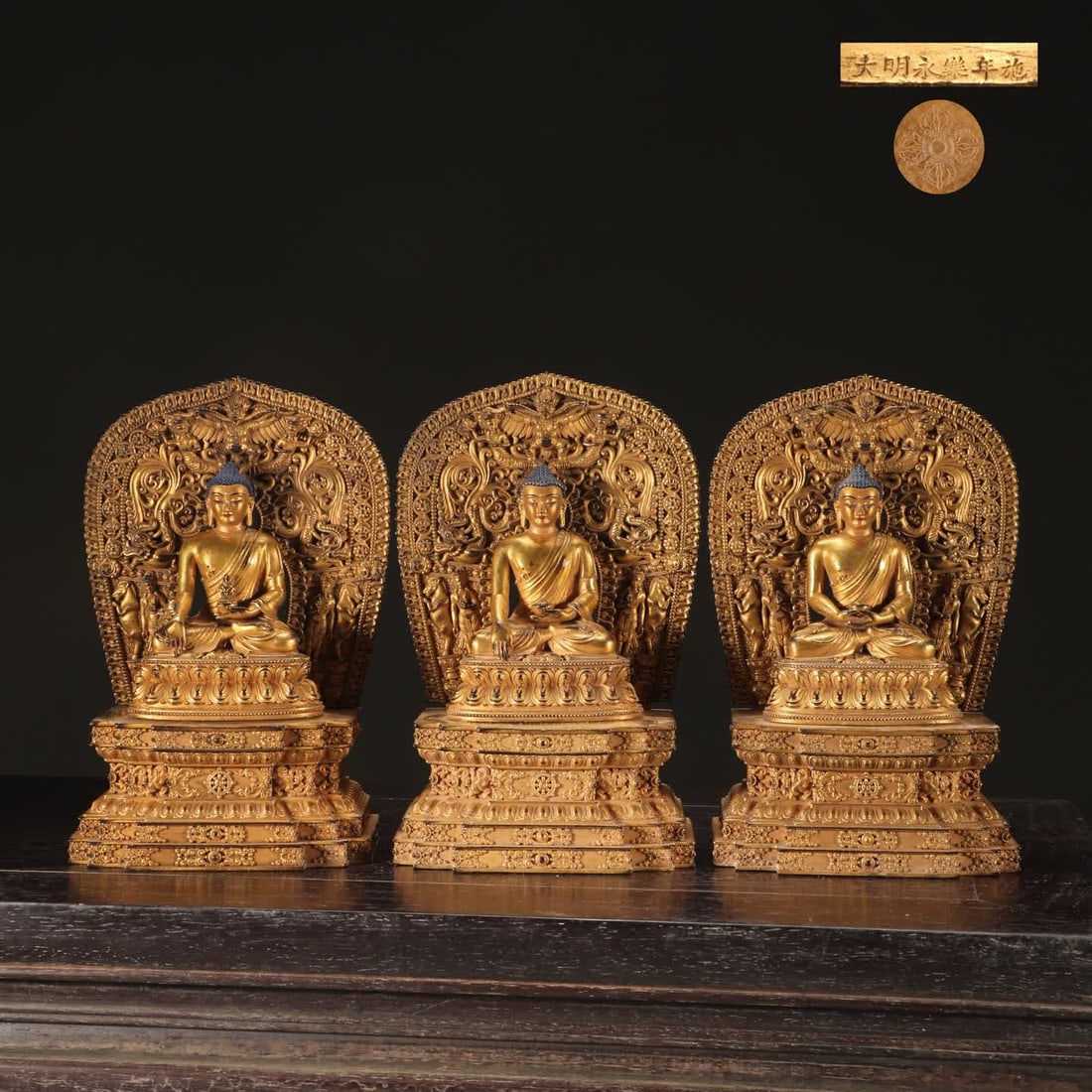 A set of seated Buddha statues with precision-cast copper tires gilded (1 of 9)