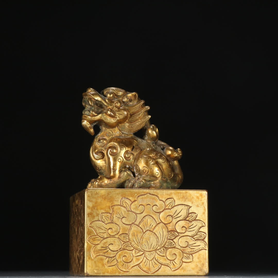 A Qing Dynasty copper gilt auspicious beast button seal (1 of 9)