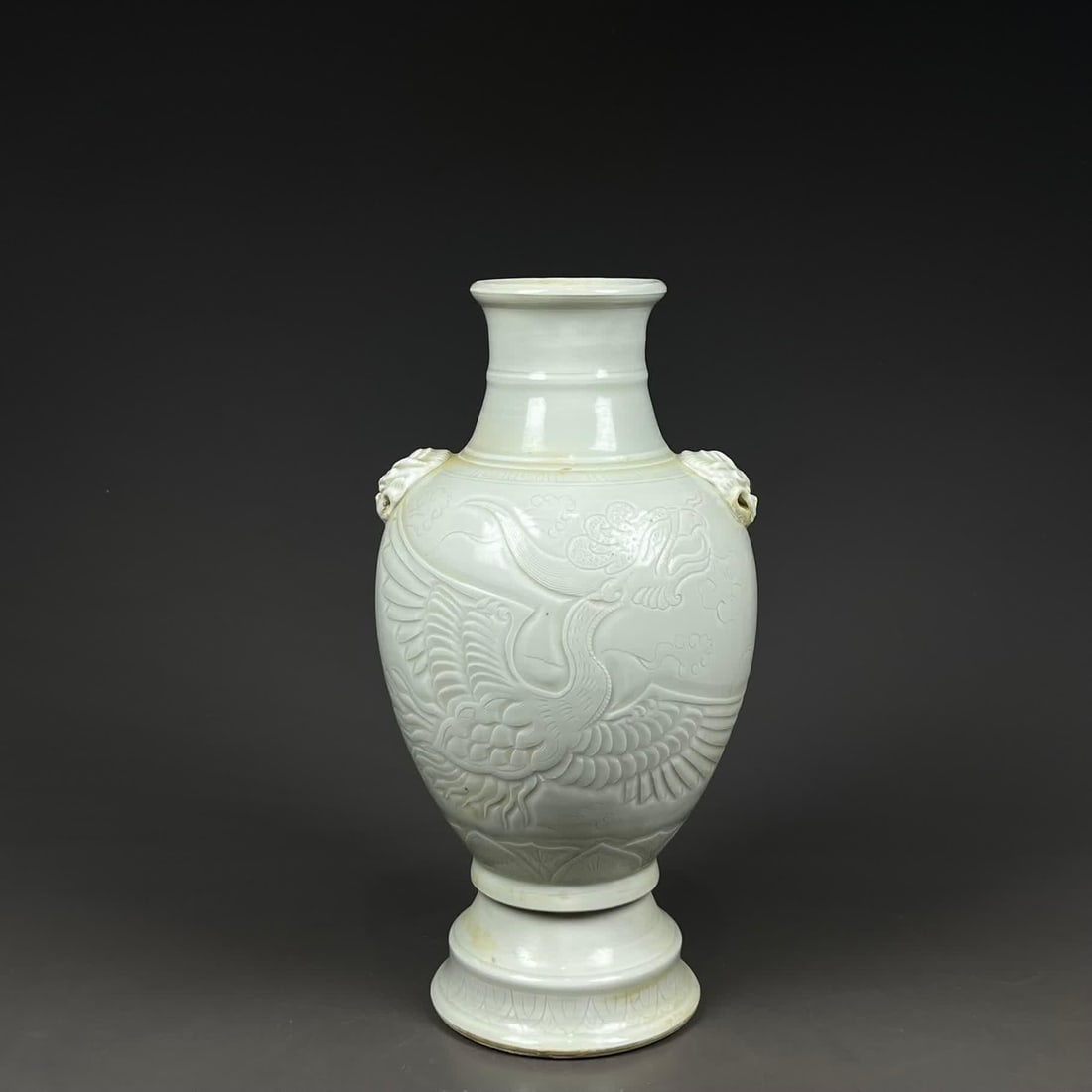 A Song Dynasty Ding kiln white glaze carved phoenix pattern animal ear bottle (1 of 9)