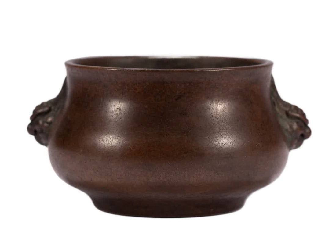 A Qing Dynasty copper incense burner (1 of 9)