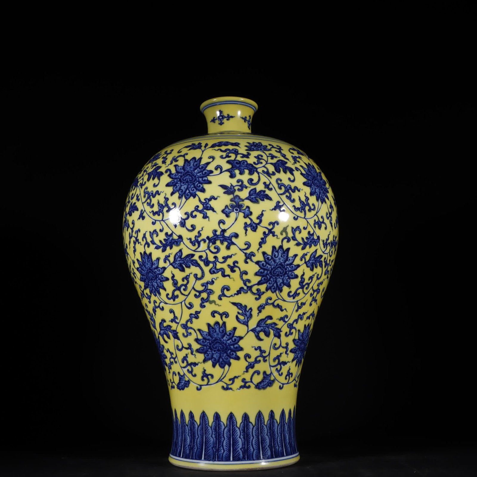 A Qing Dynasty Qianlong yellow glaze blue and white entwined flower pattern plum vase (1 of 9)