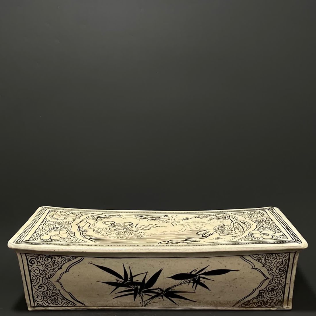 A bamboo pattern porcelain pillow of the Song Dynasty Cizhou kiln white ground and black flower: Song Dynasty Cizhou kiln white ground black flower figure bamboo pattern porcelain pillow SIZE: H:12cm W:45cm (The Dimensions Of All Batches Are Manually Measured.If You Need More Detailed