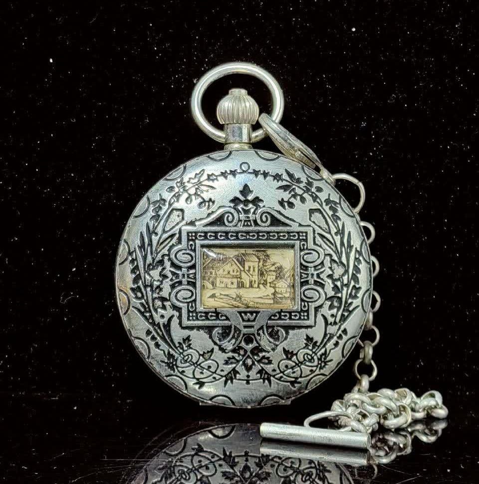 A double-open pocket watch of the sun, moon and stars (1 of 6)