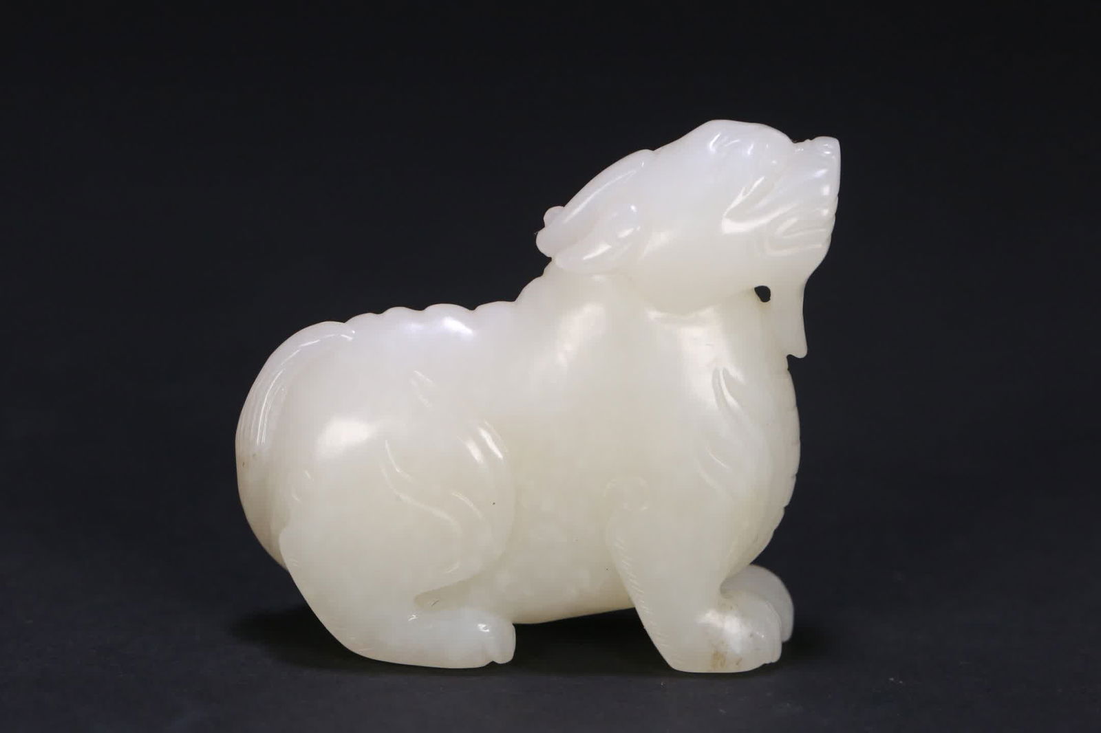 A carving of Hetian jade auspicious beasts (1 of 9)