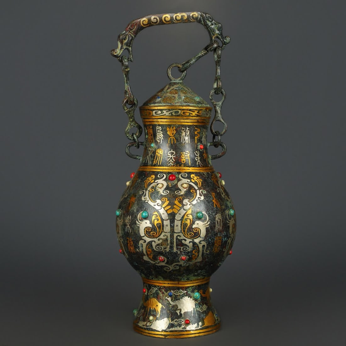 A Han Dynasty bronze Cuo gold and silver inlaid turquoise chain beam bottle (1 of 9)