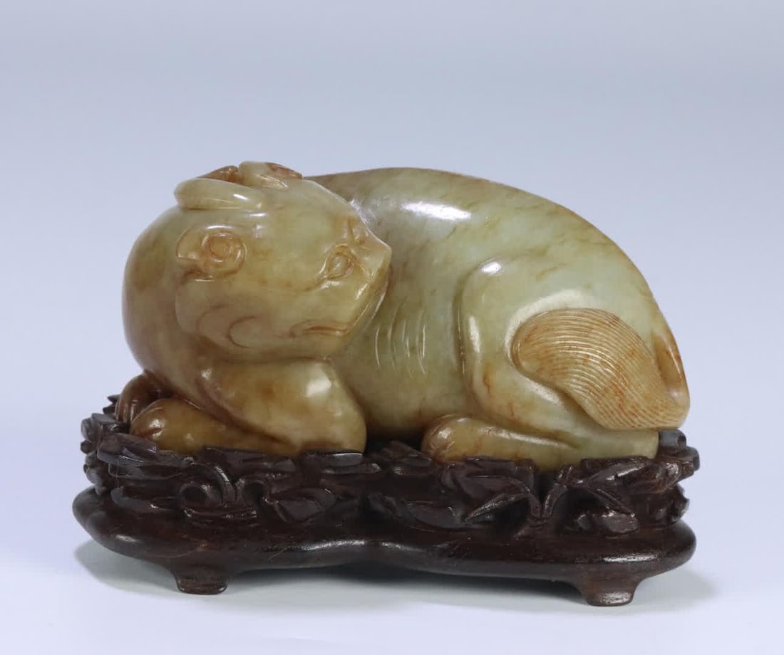 A Qing Dynasty Hetian jade beast ornament (1 of 12)