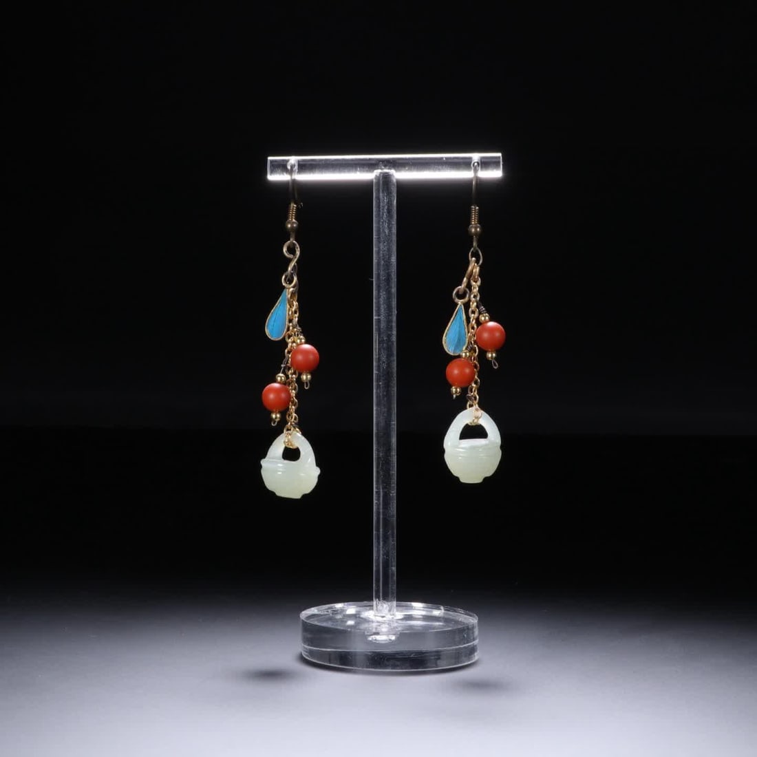 A Qing Dynasty emerald white jade earring (1 of 6)